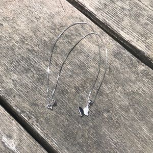 Silver sparkly butterfly necklace.